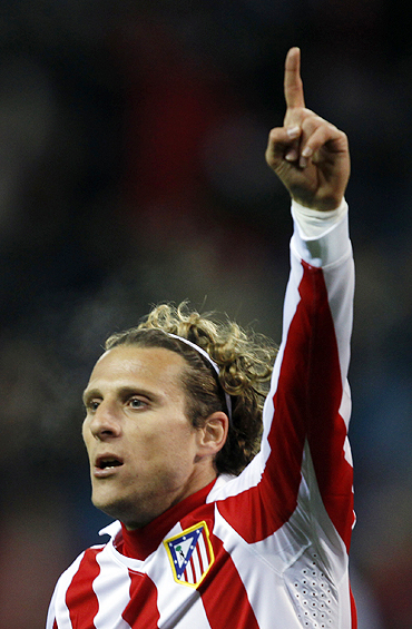 Atletico Madrid's Diego Forlan celebrates after scoring against Aris on Wednesday