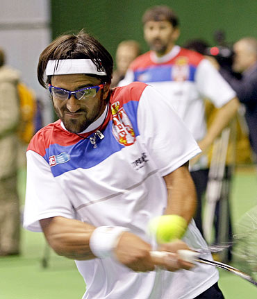 Serbia's Janko Tipsarevic hits a return during a team training session in Belgrade