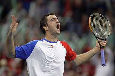 Serbia's Viktor Troicki reacts during his Davis Cup match against France's Michael Llodra in Belgrade