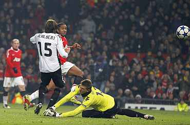 Manchester United's Anderson scores past Valencia's Vicente Guaita during their Champions League Group C match at Old Trafford
