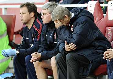 Arsene Wenger reacts during a match