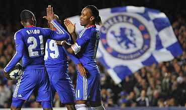 Chelsea players celebrate after a goal during a match