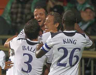 Tottenham Hotspurs players celebrate during a match