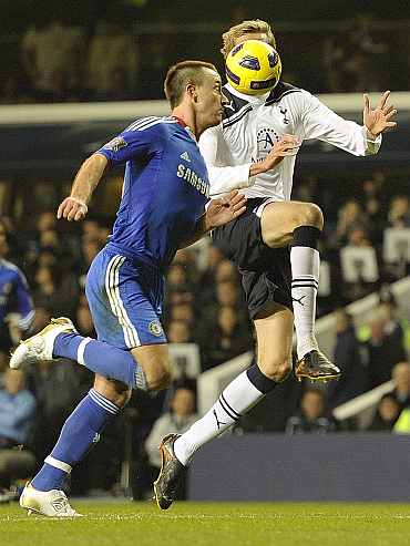 Chelsea's John Terry challenges Tottenham Hotspurs' Peter Crouch duing their EPL match