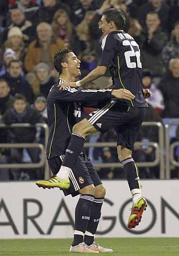 Real Madrid's Cristiano Ronaldo and Angel Di Maria after scoring a goal against Real Zaragoza