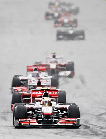 McLaren's Hamilton leads the pack at an F1 race