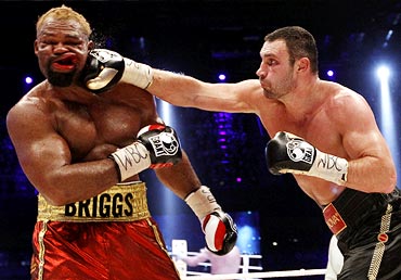 Vitali Klitschko (right) of Ukraine lands a punch on Shannon Briggs of the US