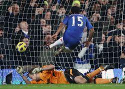 Florent Malouda (No 15) scores past Bolton Wanderers' goalkeeper Jussi Jaaskelainen