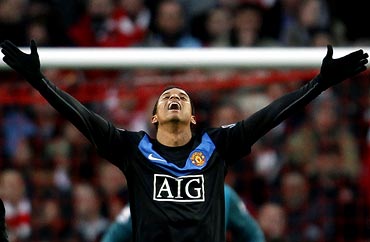 Manchester United's Nani celebrates after scoring a goal