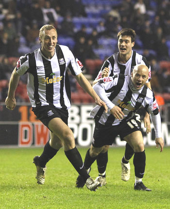 Notts County's Stephen Hunt (left) celebrates with team-mates after scoring against Wigan Athletic during their FA Cup match on Tuesday