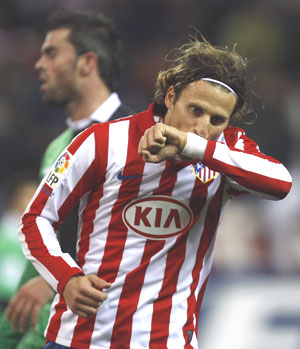 Atletico Madrid's Diego Forlan celebrates after scoring against Racing Santander during their King's Cup semi-final first leg on Thursday