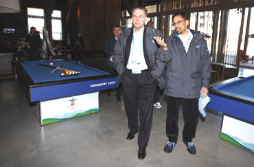 IOC President Rogge (left) tours a recreation room at athletes' village in Vancouver
