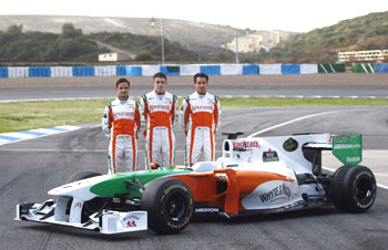 Force India drivers pose next to their car during the official presentation of the Force India Formula One Team 2010 at the Jerez racetrack on Wednesday