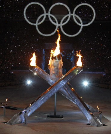 The Olympic flames burn in the stadium during the opening ceremony of the Vancouver 2010 Winter Olympics