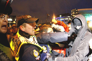 Protestors scuffle with police outside the BC Place before the start