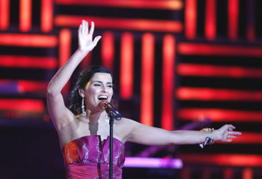 Canadian singer Nelly Furtado performs at a medal ceremony on Sunday