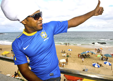 Brazilian musician Carlinhos Brown presents the new national soccer jersey in Salvador, Brazil on Sunday