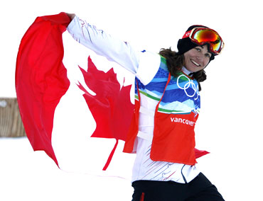 Canada's Maelle Ricker celebrates after winning the gold medal in the women's snowboard cross