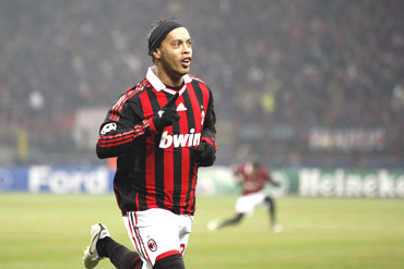 AC Milan's Ronaldinho celebrates after scoring against Manchester United