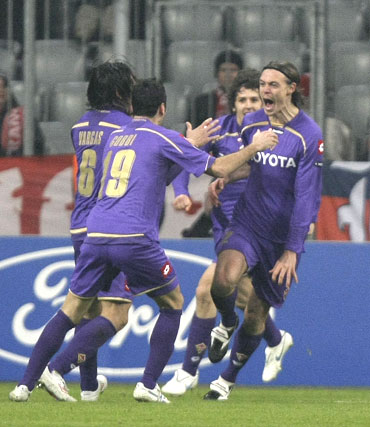 Fiorentina's Kroldrup (right) celebrates with team-mates after scoring the equaliser
