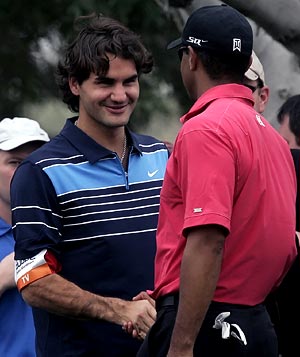 Roger Federer (left) with Tiger Woods