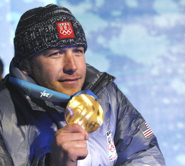 Alpine skiing gold medallist Bode Miller of the US poses with his medal during the medals ceremony