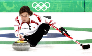 Canada's skip Cheryl Bernard delivers the stone during their women's round robin curling game