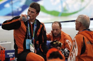 Kramer of the Netherlands drinks from a bottle after the men's 10000 metres speed skating race