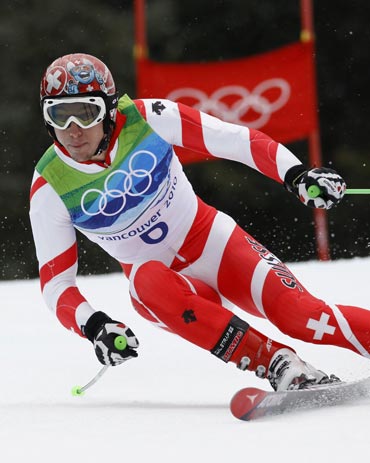 Carlo Janka becomes the first Swiss man to win the Olympic giant slalom gold since 1984