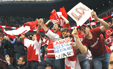 Canada hockey fans react in the stands during the ice hockey play-offs quarter-finals between Russia and Canada