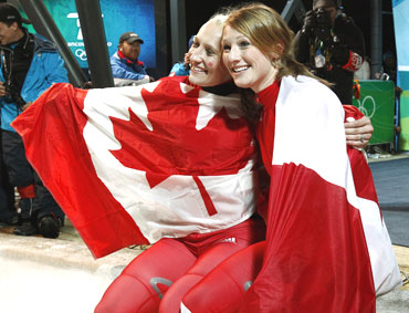 Canada's Kaillie Humphries (left) and Heather Moyse celebrate after winning gold in the women's bobsleigh event