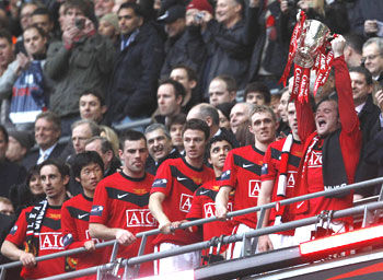 Manchester United player celebrate after winning Carlin Cup