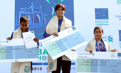 Winner Shastri Devi is flanked by Jyoti Gawate and Indresh Dhiraj