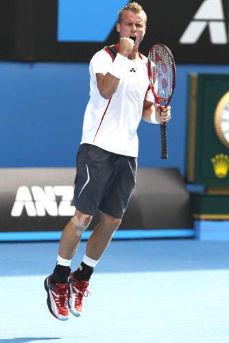 Lleyton Hewitt exults after defeating Donald Young of the US