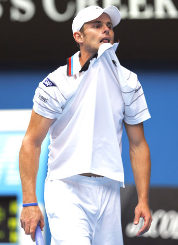 Andy Roddick reacts during his match against Feliciano Lopez