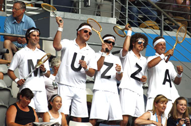 Andy Murray's supporters cheer him on during his match against France's Florent Serra