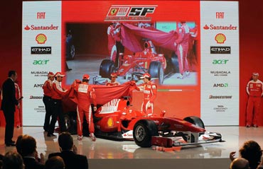 Fernando Alonso and Felipe Massa whip off the covers to reveal the new car