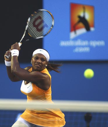 Serena Williams hits a backhand