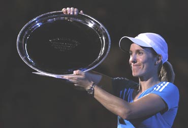 Justine Henin with the runners up trophy