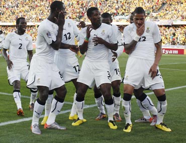 Ghana players celebrate after a goal