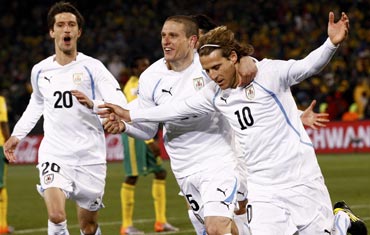 Diego Forlan (right) celebrates with team-maters