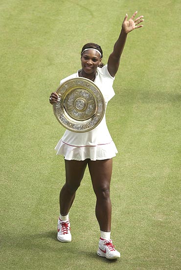 Serena Williams with the winners trophy after defeating Russia's Vera Zvonareva in the women's singles final