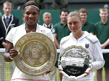 Serena Williams (left) and Vera Zvonareva with their trophies