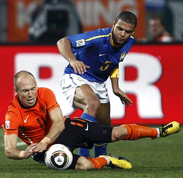 Felipe Melo (right) fouls Arjen Robben to receive a red card