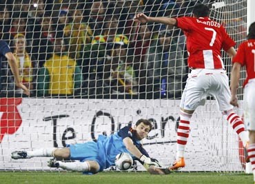 Iker Casillas saves a penalty by Paraguay's Cardozo
