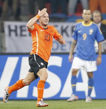 Wesley Sneijder celebrates after scoring the winner against Brazil