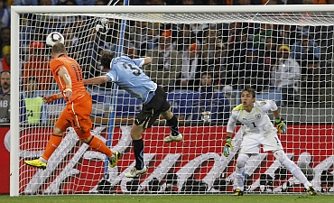 Arjen Robben heads the ball into the net