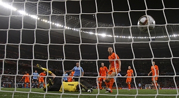 Uruguay's Pereira scores a goal past Netherlands' goalkeeper Stekelenburg