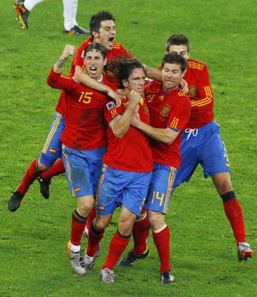 Carlos Puyol celebrates after scoring against Germany