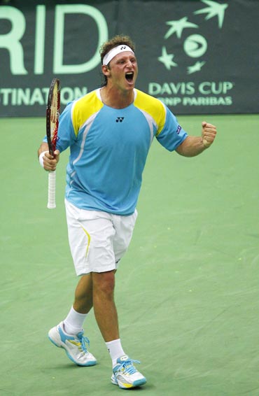 Argentina's Nalbandian celebrates his victory during their Davis Cup World Group quarter-final match
